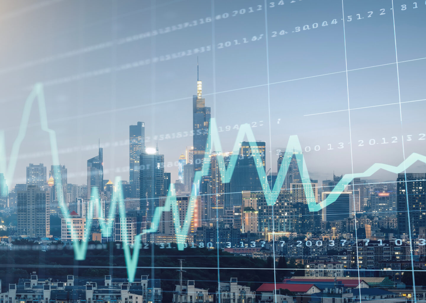 City skyline with translucent stock charts and numeric data overlaid across the buildings and sky.